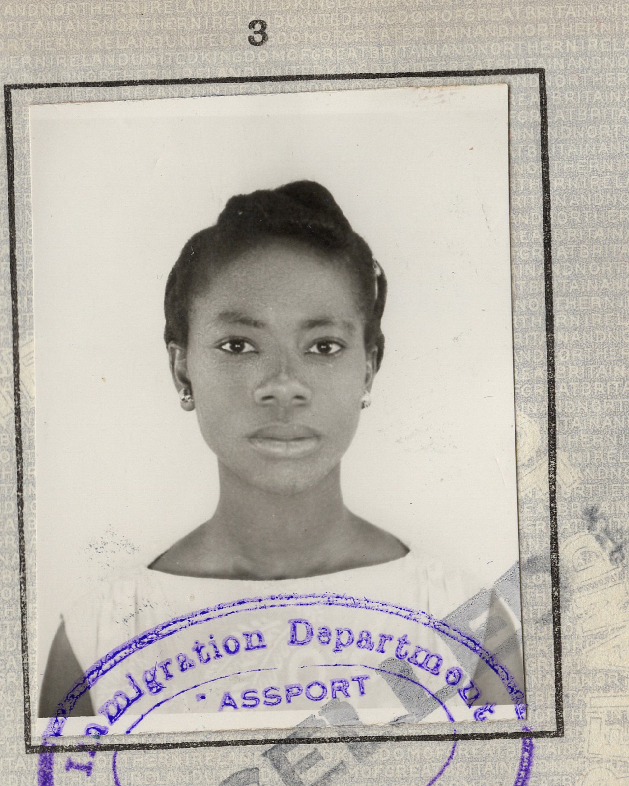 A black and white passport photo of a woman with her hair pulled back.