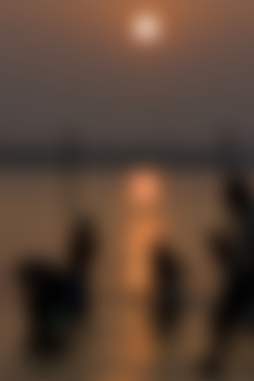 INDIA. 1. Uttar Pradesh. Allahabad. Hindu pilgrims perform dawn rituals in Sangam, at the confluent of the Ganges, the Yamuna and the Sarawati rivers.
