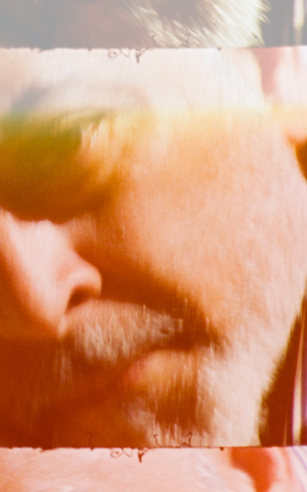A film photo of a man's face.