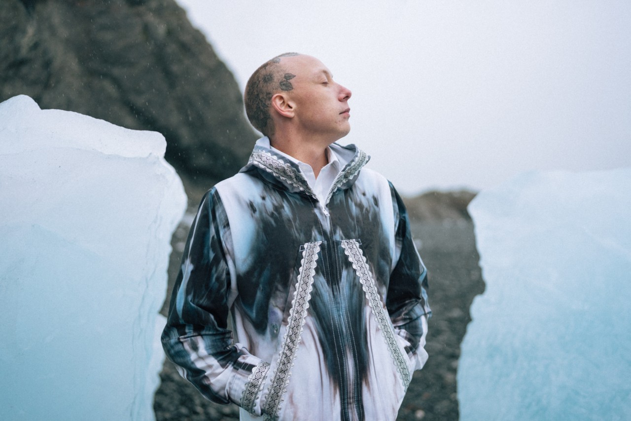Quinn Christopherson poses in front of an icy backdrop.