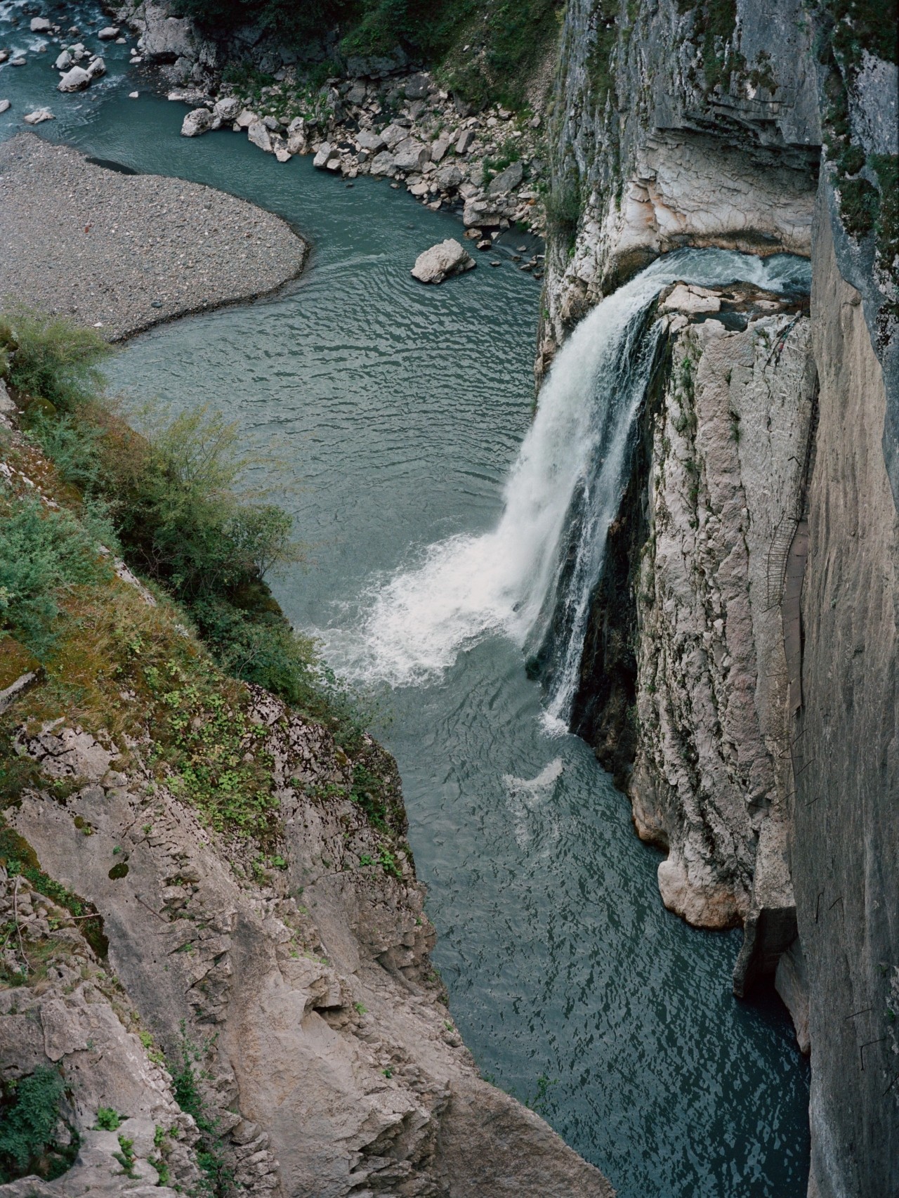A bird's eye view of a cascading waterfall.