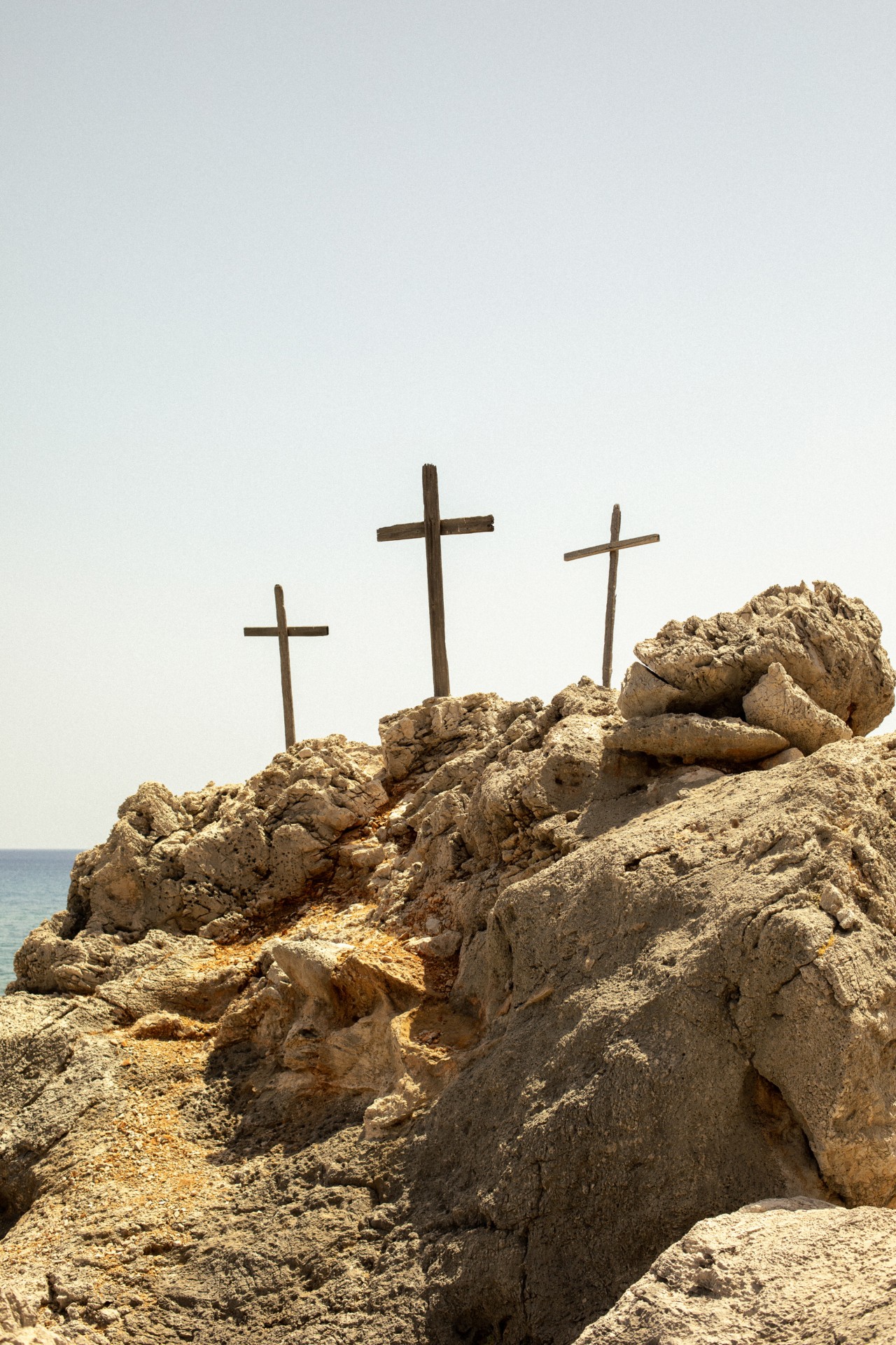 Three crosses on a rock
