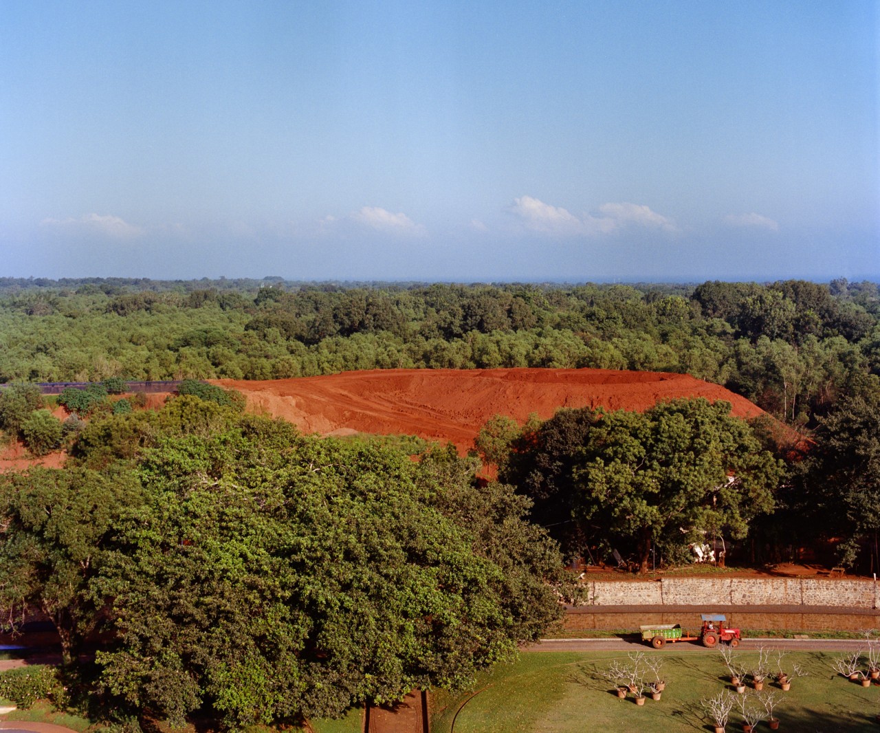 The landscape of the trees and hills of Auroville in India.
