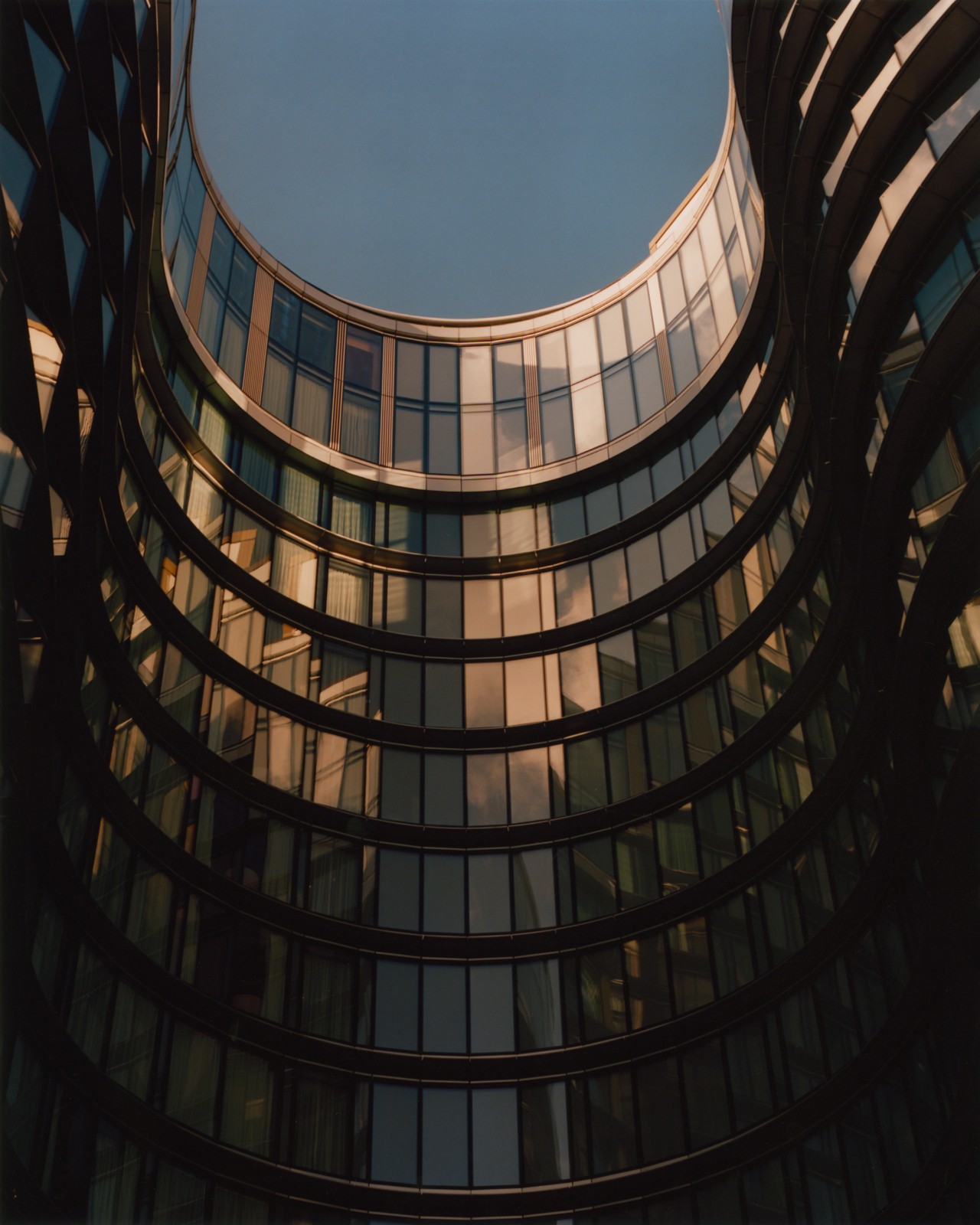 The interior of a cylindrical glass building.