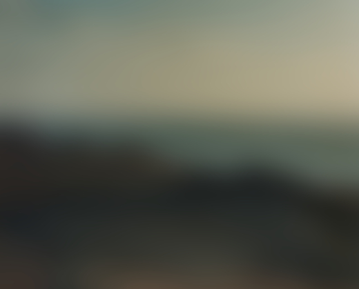 Small mountain dunes frame the distant ocean.