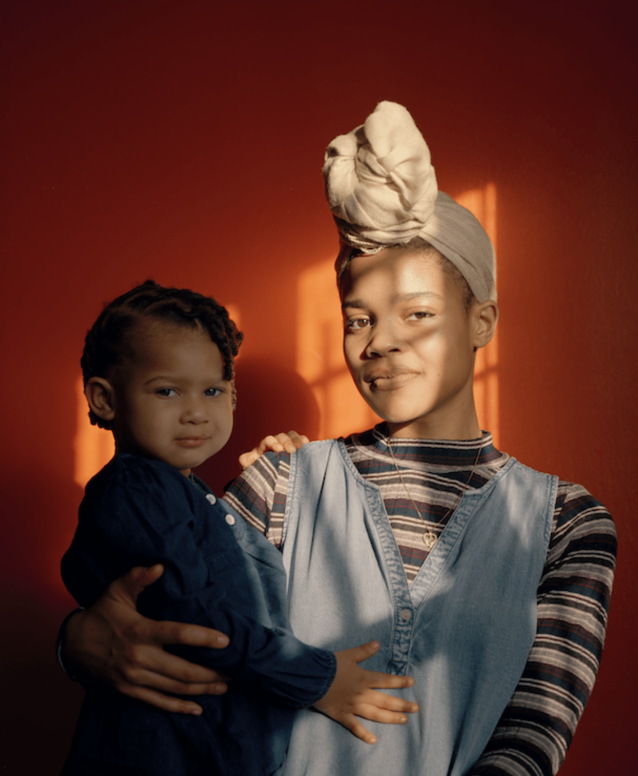 A young mother holds her child in a Washington. D.C home.