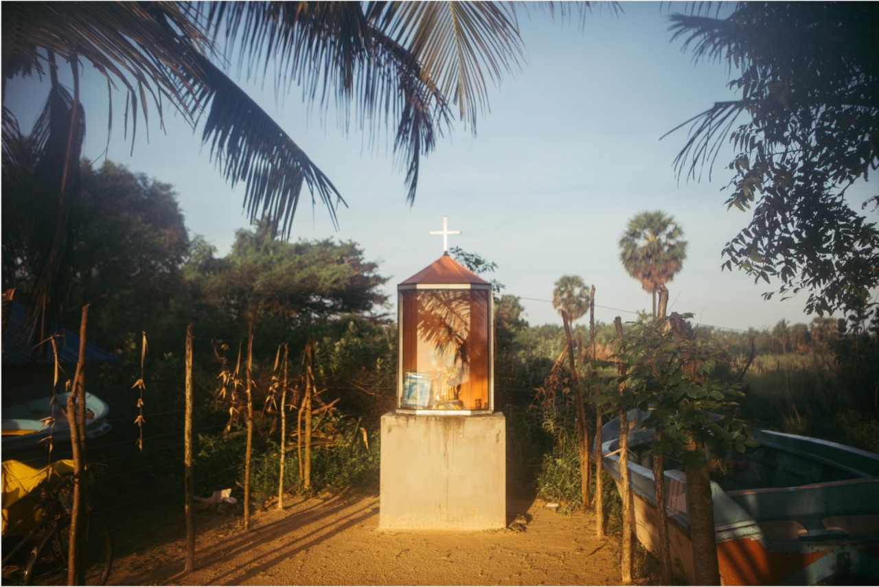 Many fishing communities in Sri Lanka are Christian in a majority Buddhist nation. A Catholic shrine near catamaran boats on Pasikuda Beach in eastern Sri Lanka.
