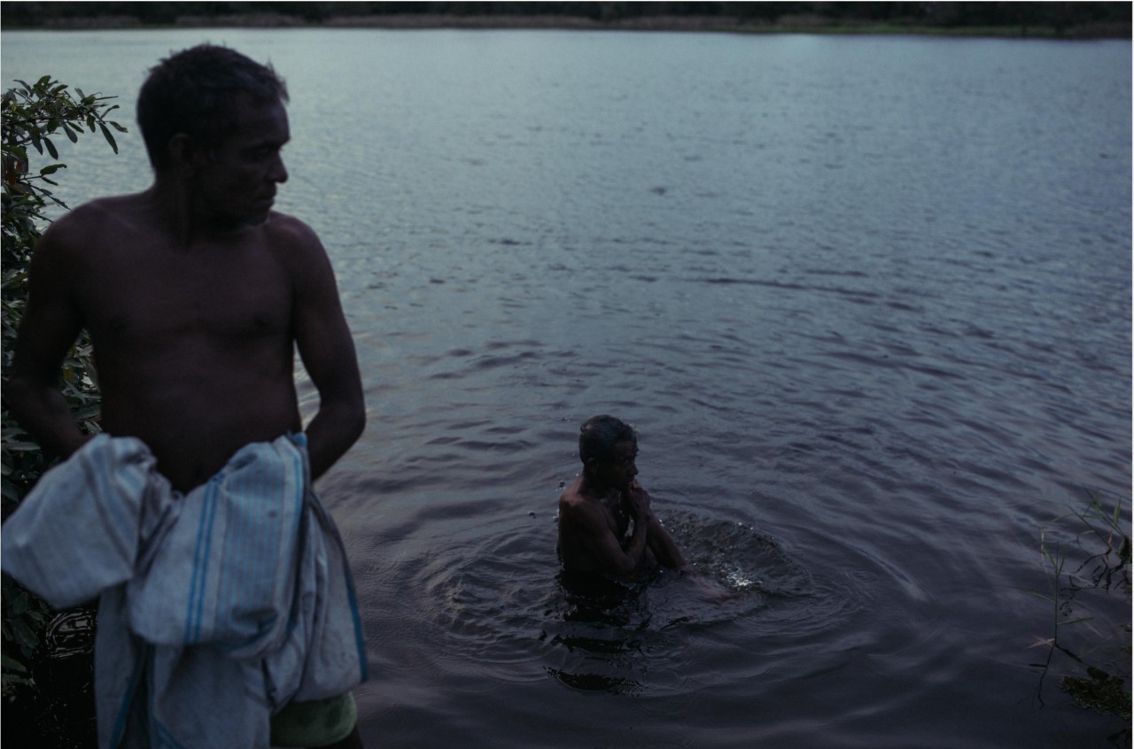 At dusk, villagers bathe in a lake in Medirigiriya, north-central Sri Lanka, a hotspot for CKDu.