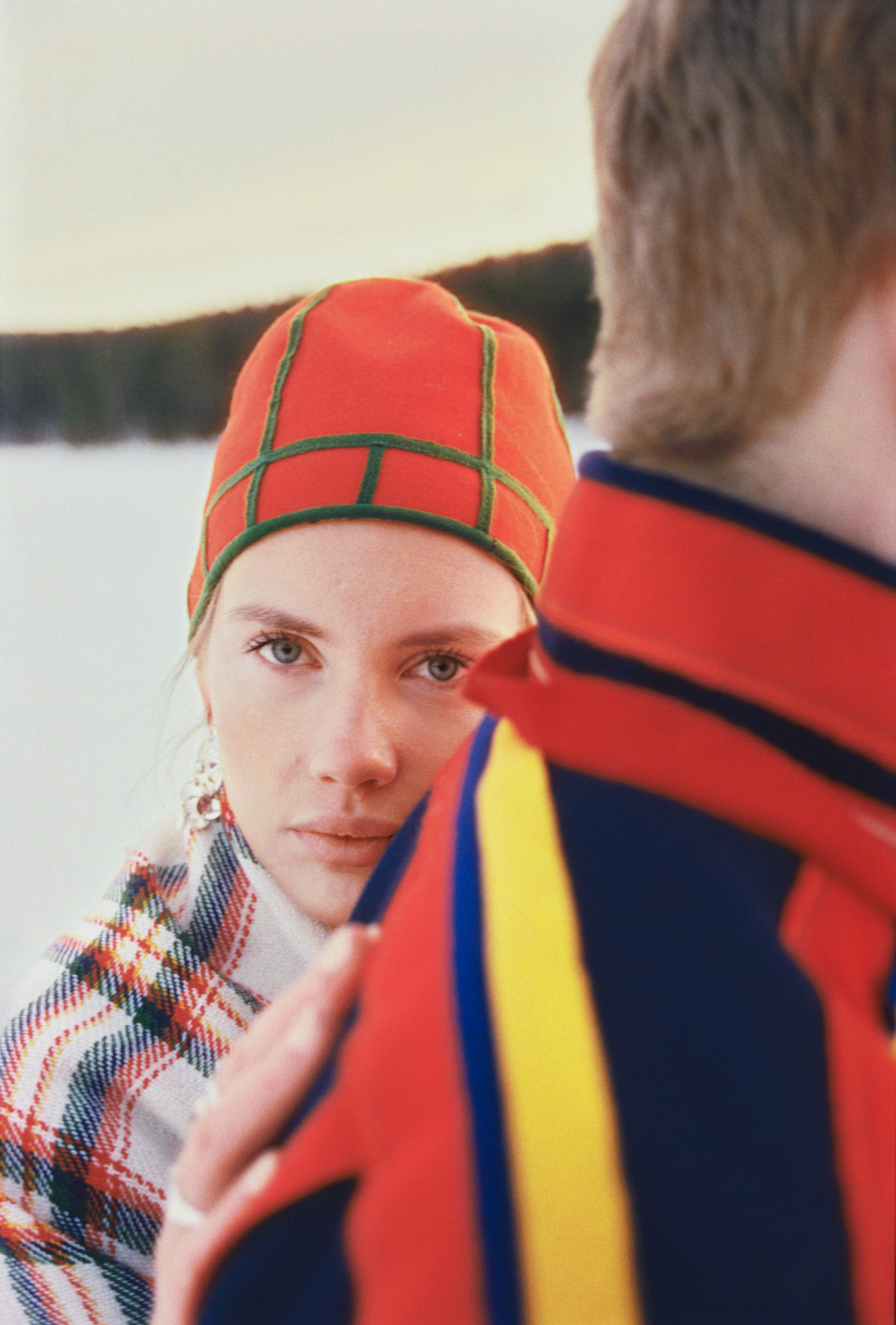 Evelina Solsten rests their hand on someone's back.