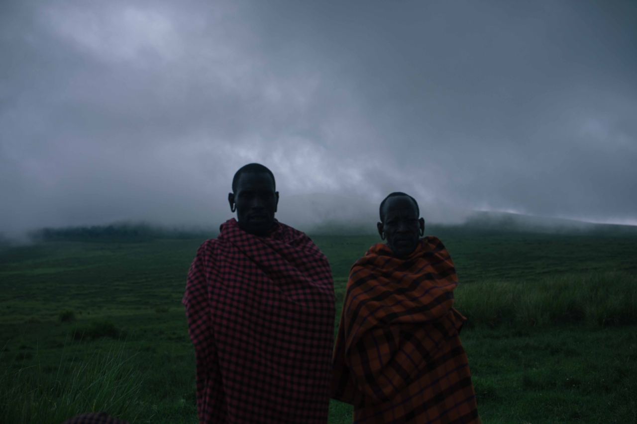 Maasai villagers of Kayapus Village, kept warm by their shukas amidst the rainy season.