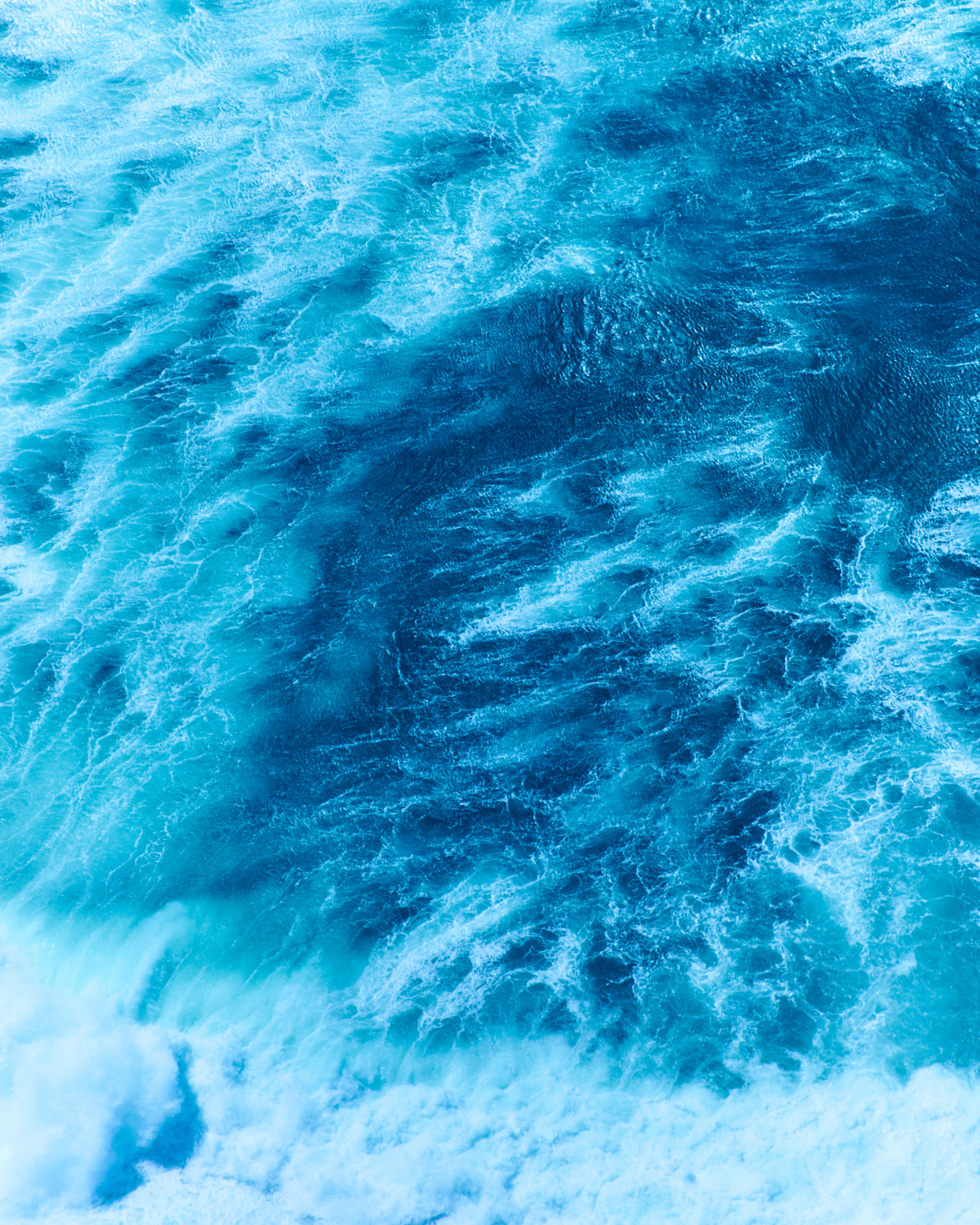 A swirl of blue and white ocean waves.