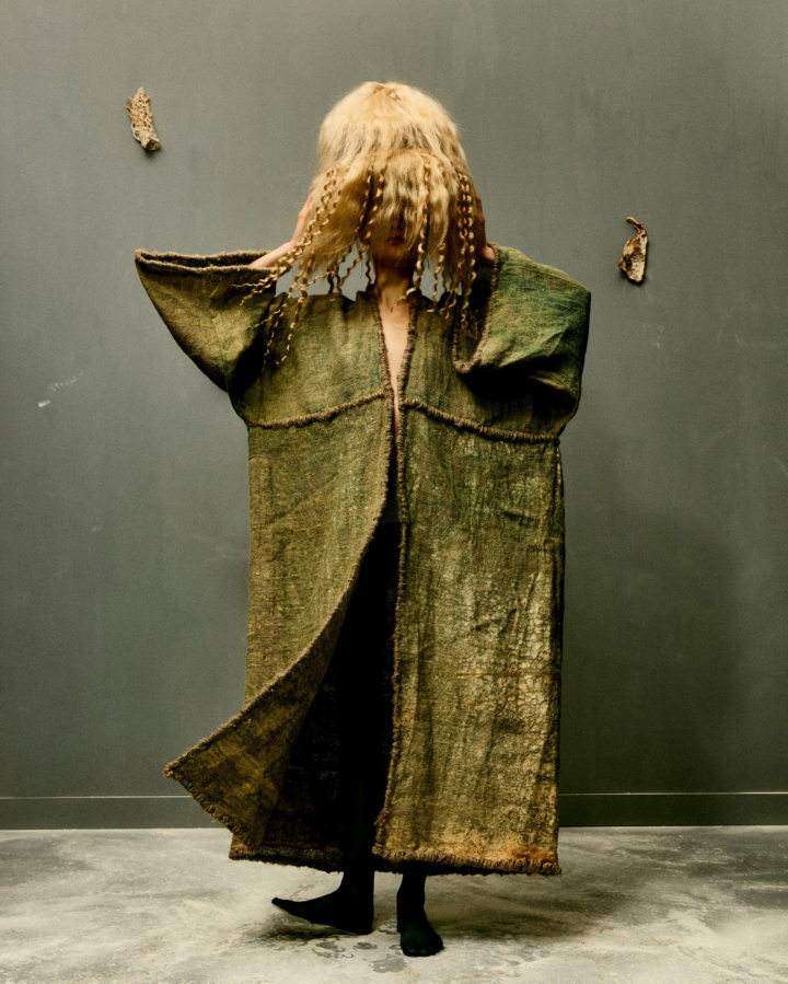 Coat made from hemp yarn, polypore fungi, and cyanobacteria.