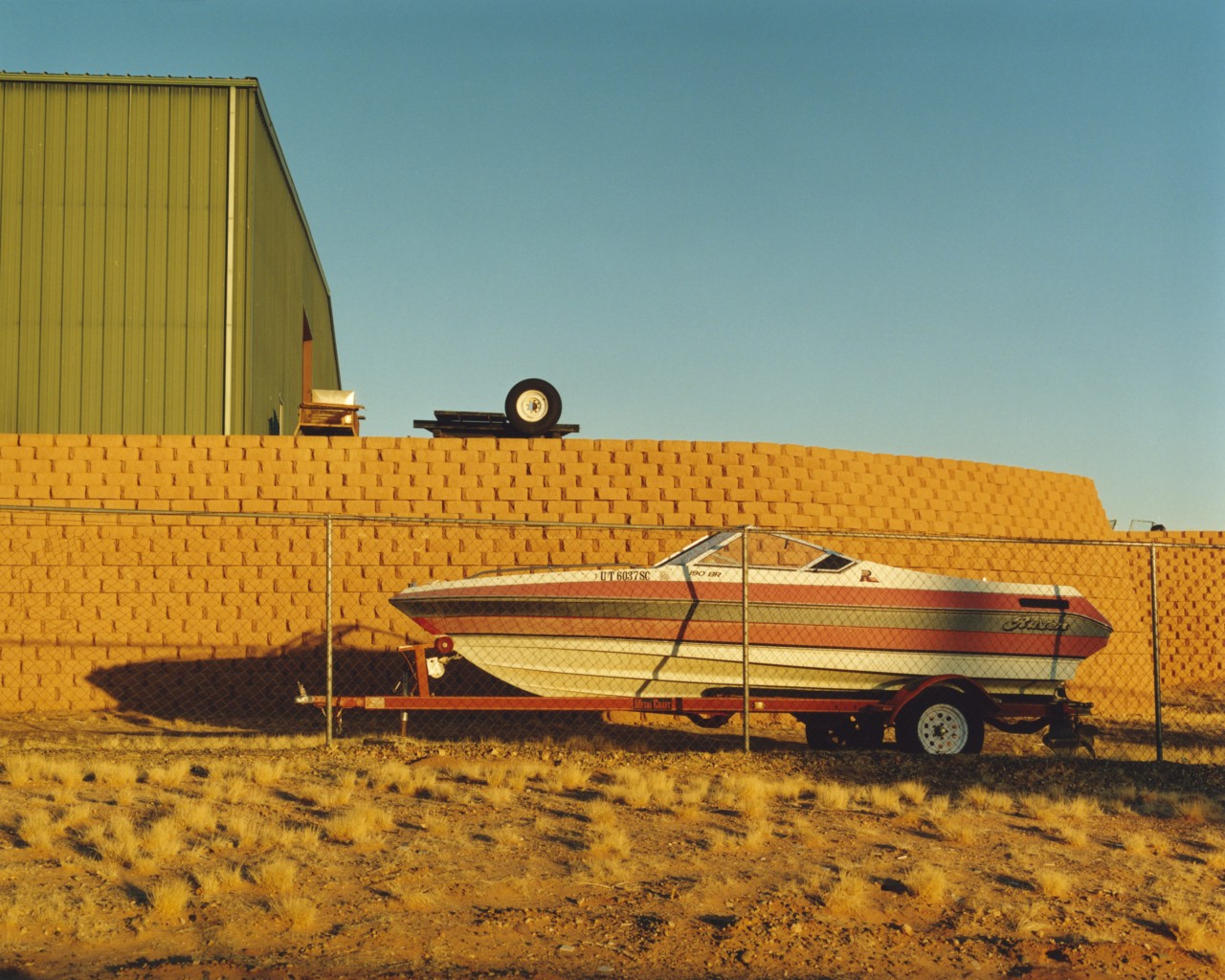 A boat outside someone's home in Glen Canyon.