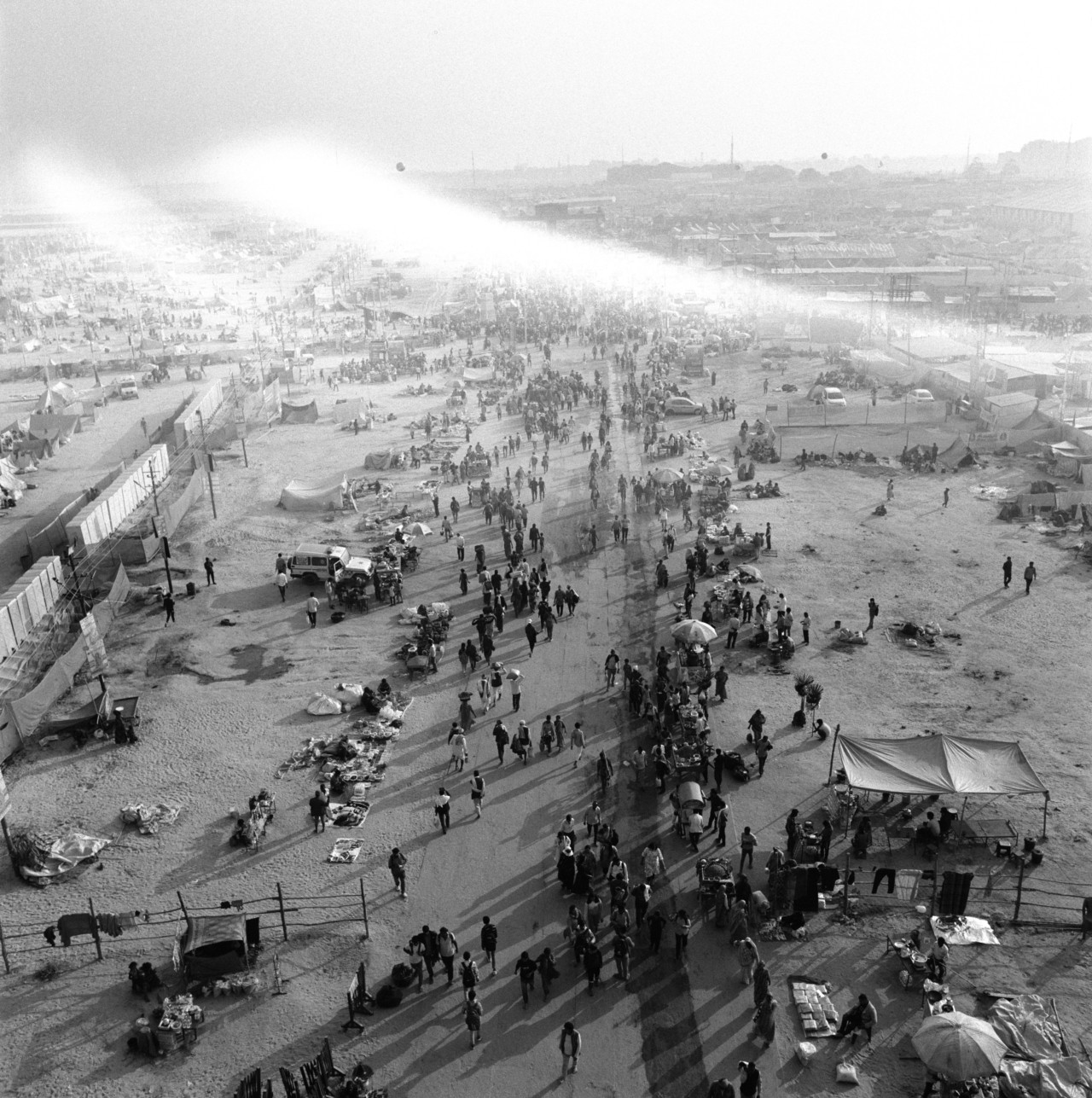 View from Shastri Bridge as pilgrims and tourists walk to the Triveni Sangam.