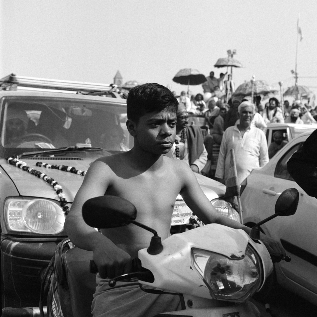 A young boy passes through the procession.
