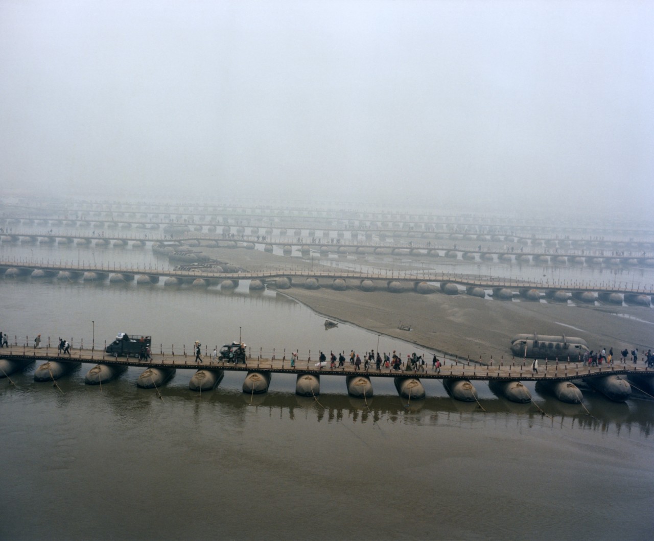 People cross a pontoon bridge, commonly known as pipe ka pul.