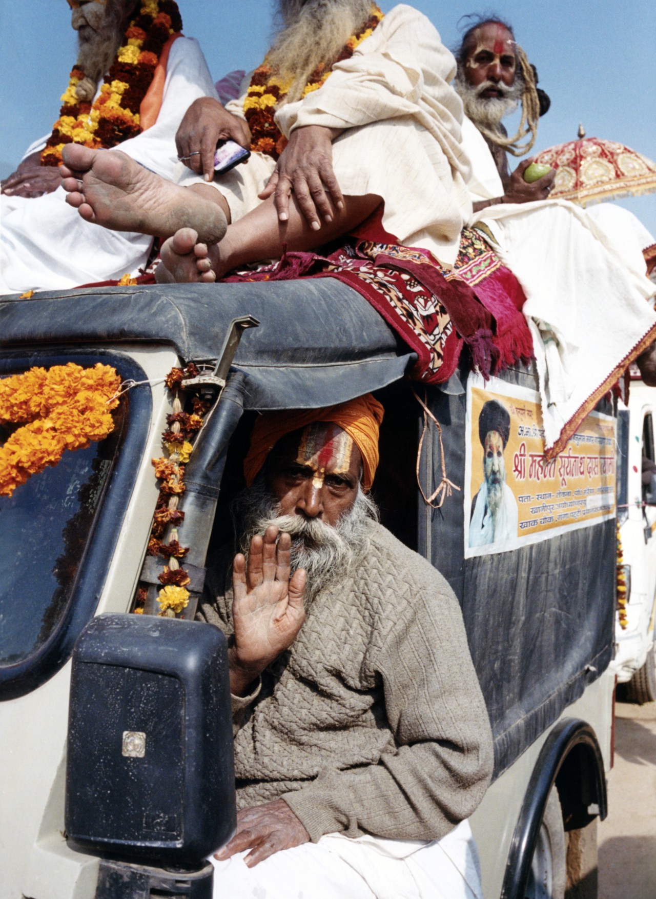 A sadhu (holy person in Hinduism) offers his blessings during a procession at Kumbh Mela.