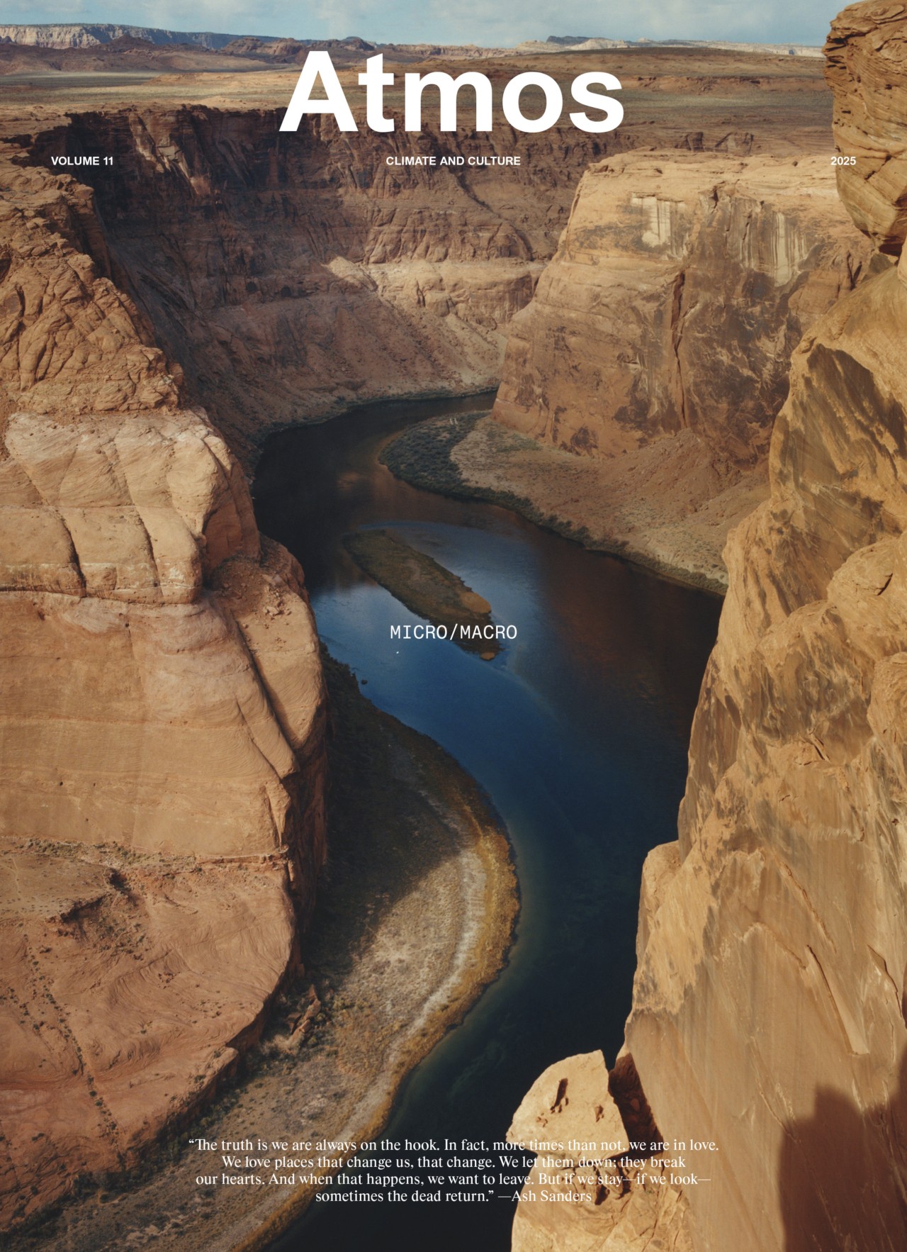 A winding river cuts through steep canyon walls under a clear sky, featured on the cover of Atmos magazine Volume 11, titled 