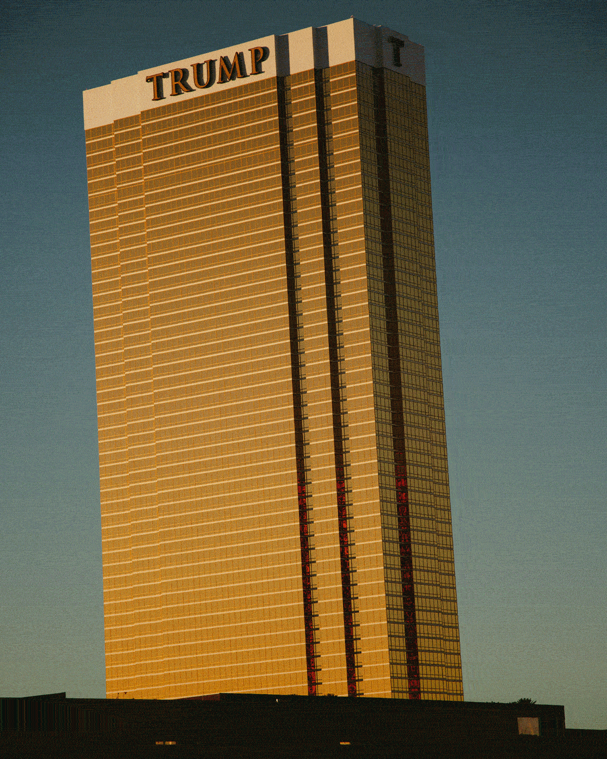 A gif of the Trump tower, a shipping yard, a refrigerator filled with sports drinks, and someone's mouth biting into plastic cherries.