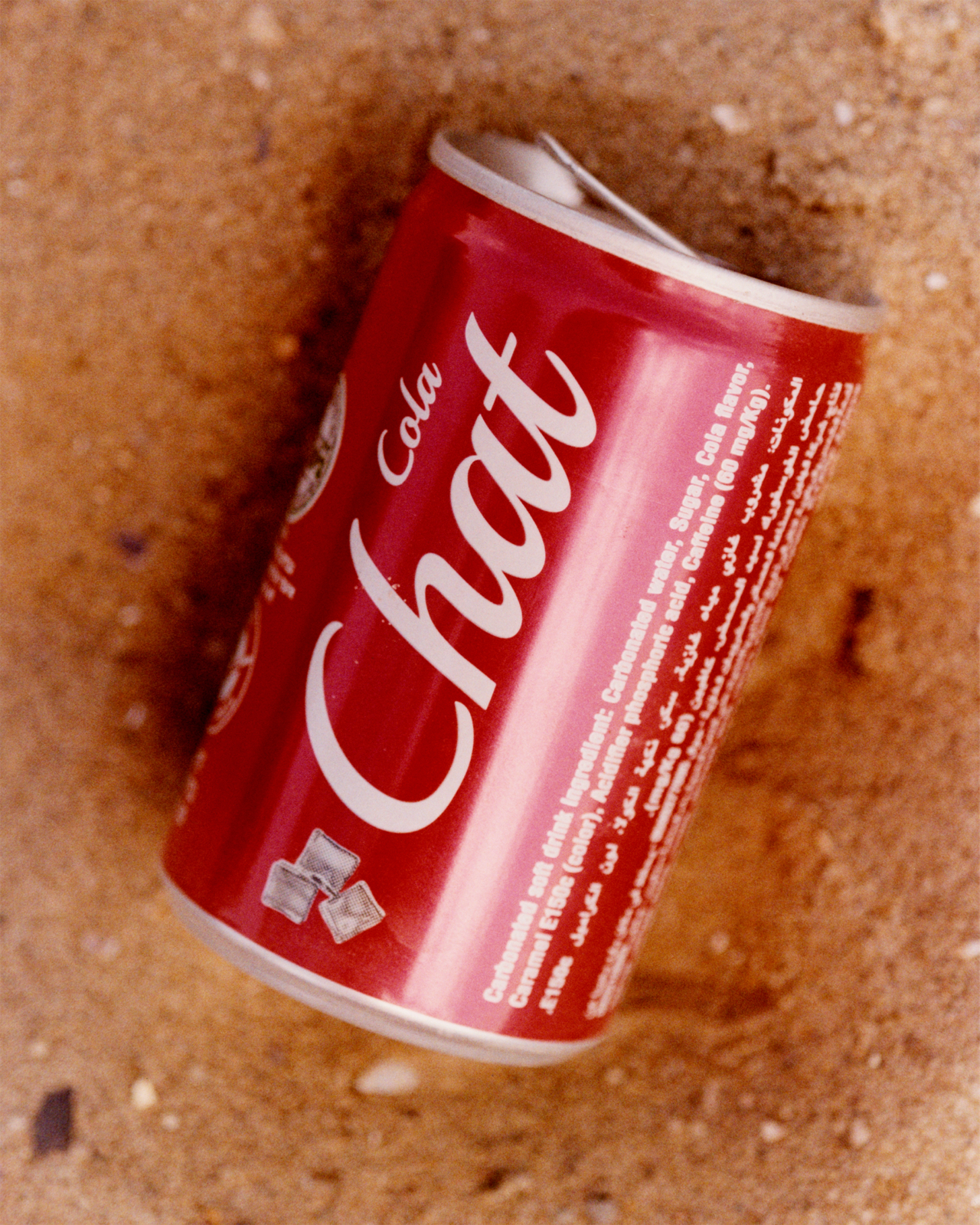 A red and white can of Gaza cola lays on its side.
