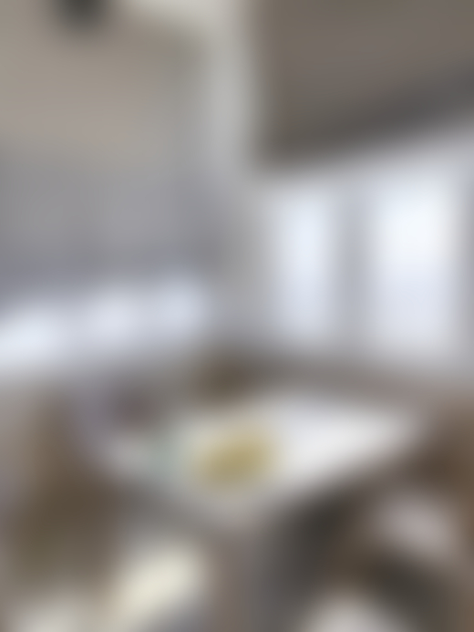 A half-eaten plate sits on a dinner table inside a home.