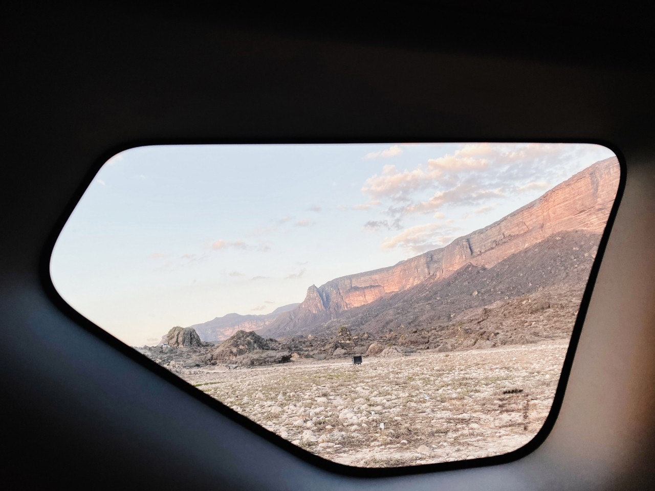 The view of mountains from a window.