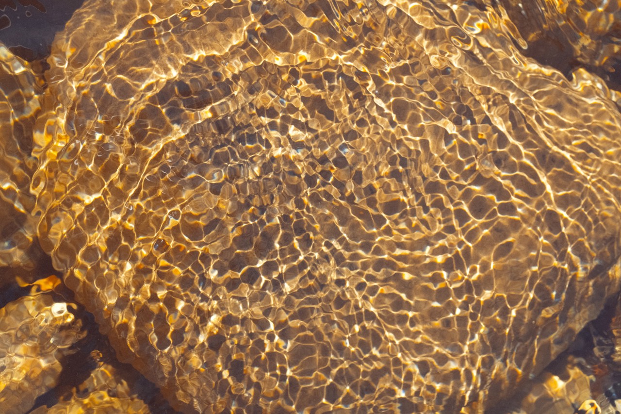 A boulder submerged in water