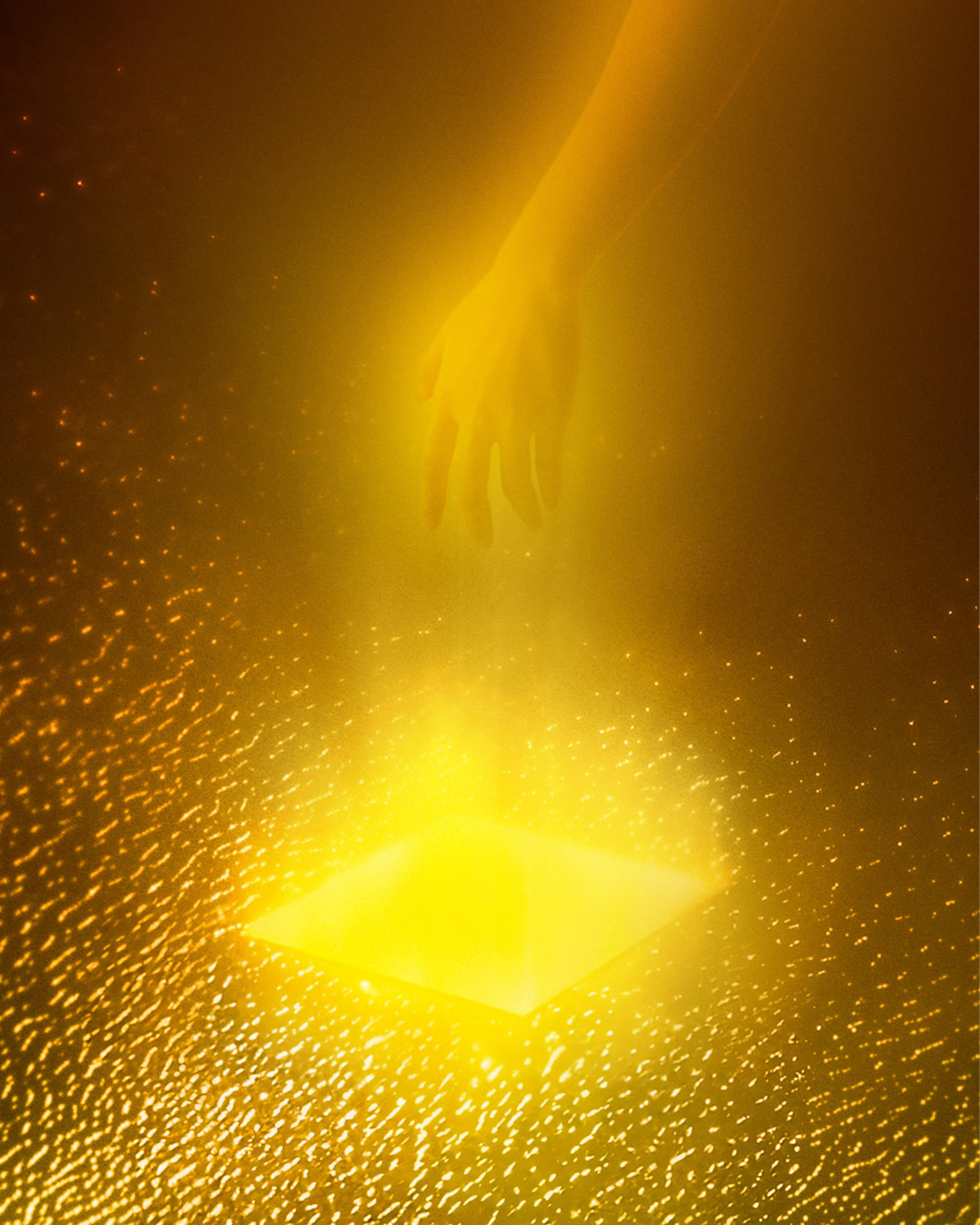 A hand reaches down toward pool of liquid gold.