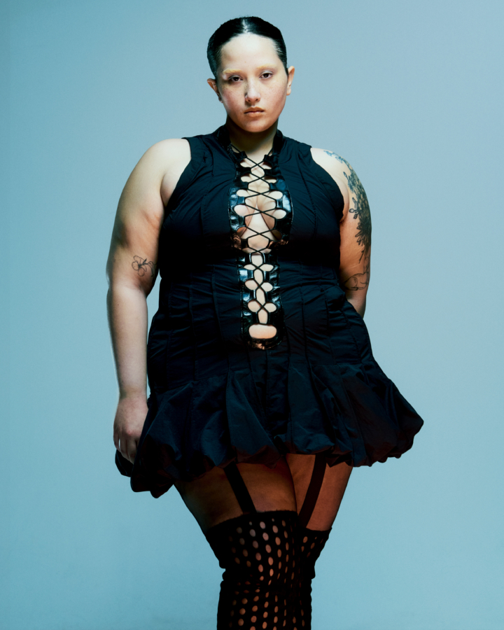 A model wears a black dress.