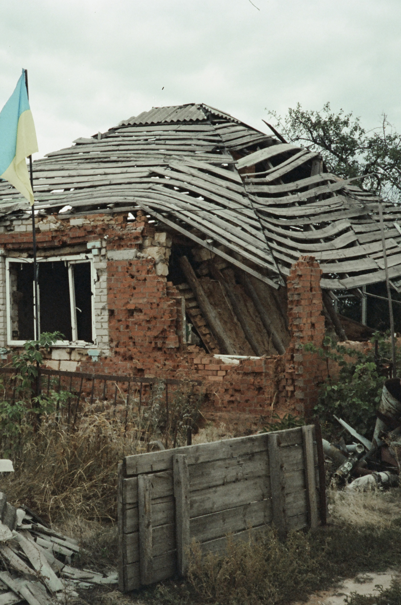 A damaged brick house.