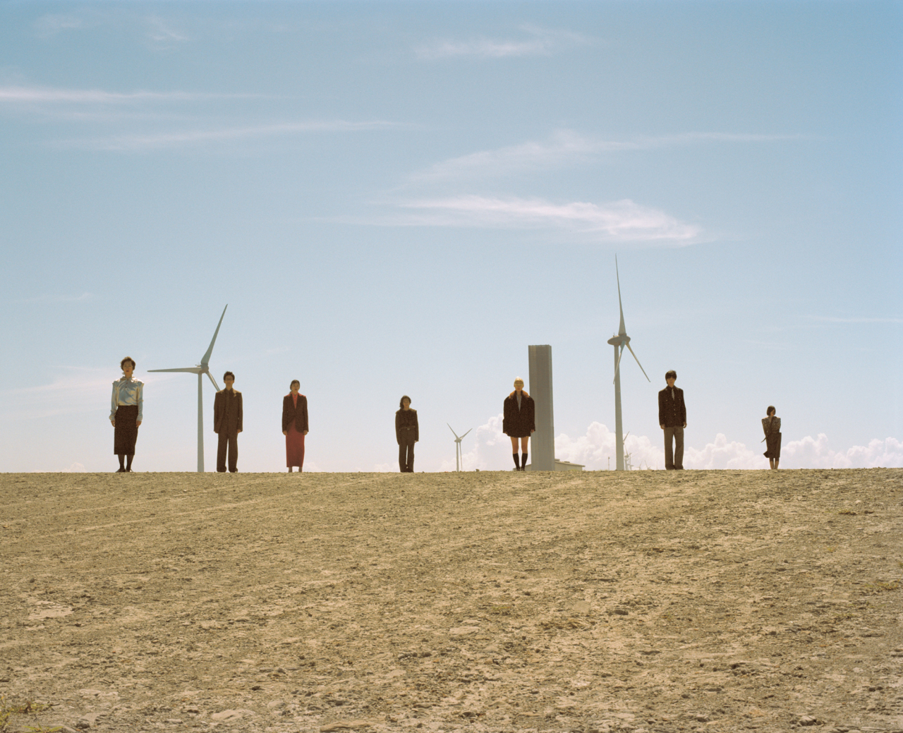 From left: Miyu wears Toga shirt, Toteme skirt, Wolford tights, vintage eyewear, stylistʼs own shoes. Koichi wears Auralee jacket, shirt, tie, belt, and pants, vintage eyewear. Yuumi wears Stella McCartney jacket, Irenis shirt, Auralee skirt; Jinichiro wears Prada knit, Lemaire pants, Our Legacy belt. Miu wears Prada jacket, shirt, and skirt, Pierre Mantoux socks, Stella McCartney shoes, stylist’s own eyewear. Souta wears Littlebig jacket, shirt, and tie, Acne Studios pants. Meguro wears Stella McCartney tops, belt, and skirt, Fumika Uchida leggings