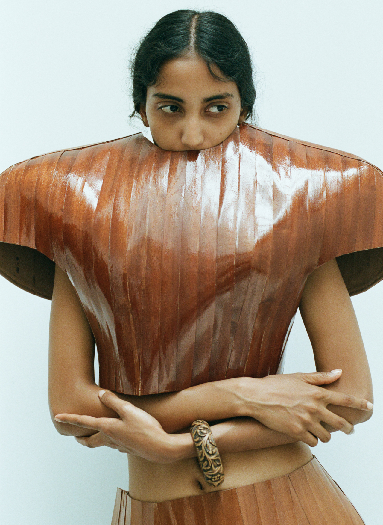 Padani wears Luna Rech top and skirt made from wood, stylist’s own bracelet