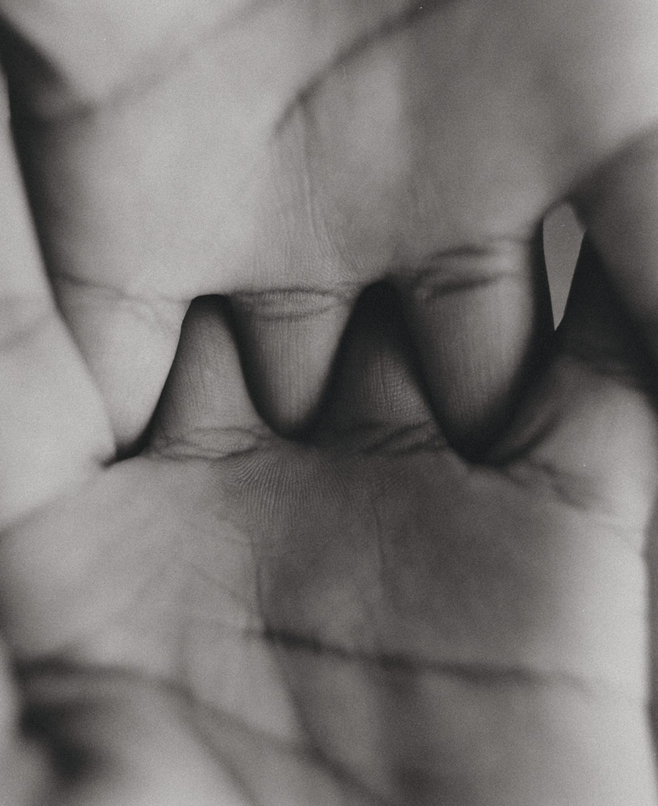 Two hands interlock.