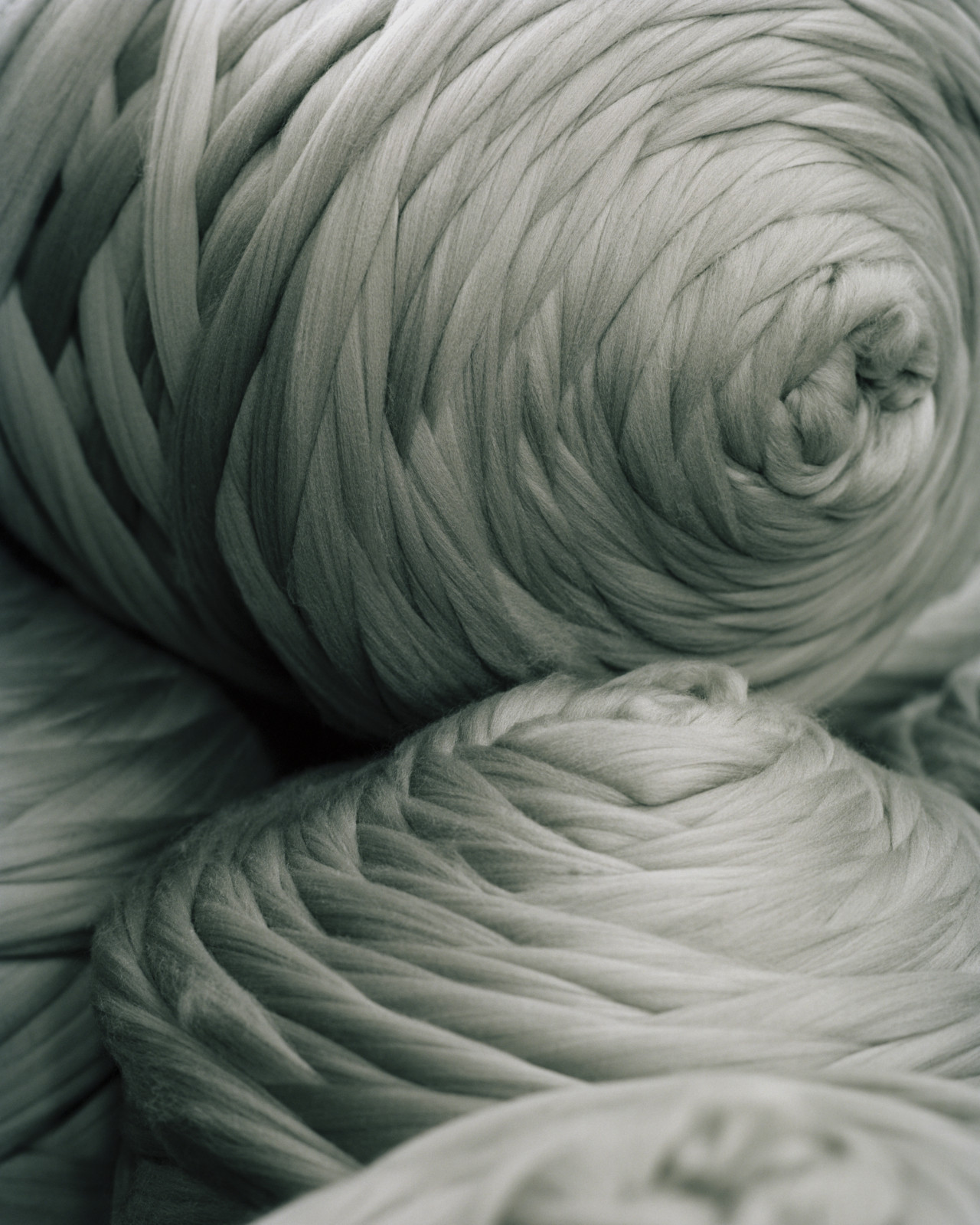 Two spools of silver yarn.