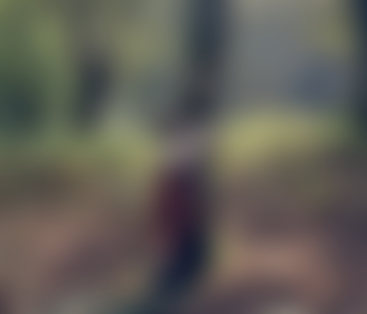 Sabela, a young Galician girl, plays in the forests of Palas de Rey, hugging a tree.