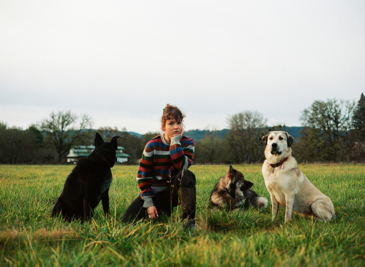 Olivia Bee poses with her dogs.