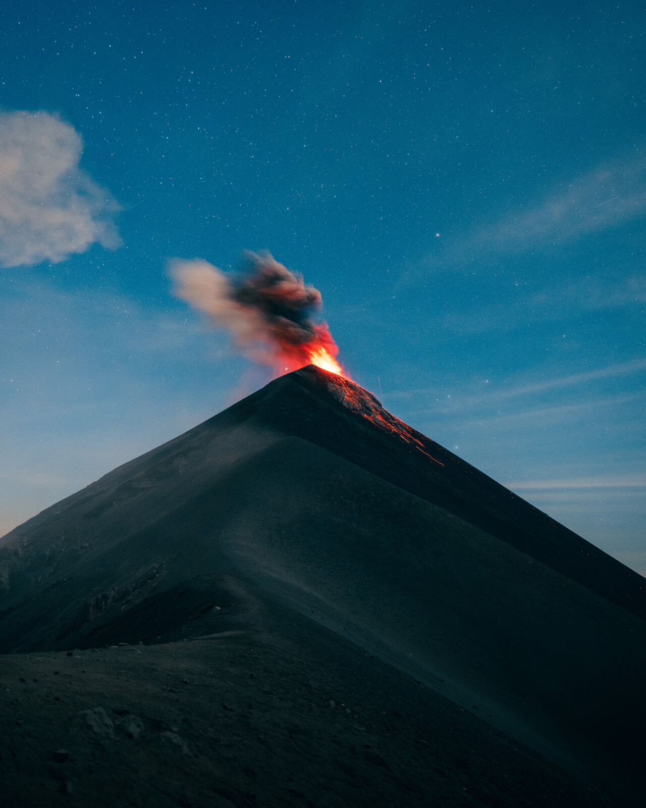 A volcano erupts.