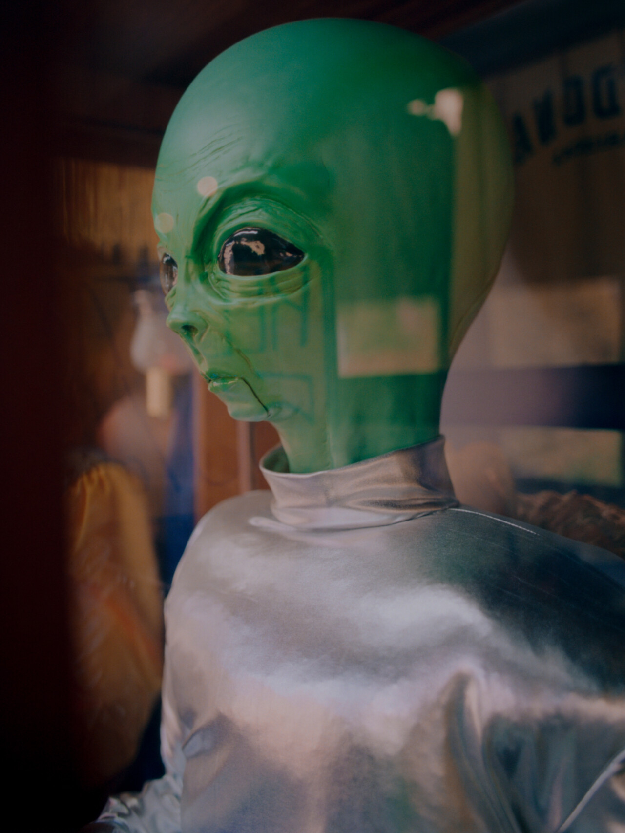 An alien mannequin encased in glass welcomes visitors outside a souvenir shop in Sedona, AZ.